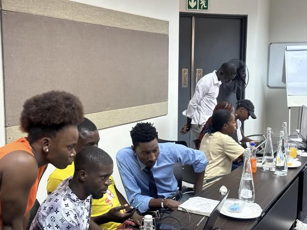 A section of training participants in groups learning about the STDM tool that will help them generate evidence using participatory and community methods to map existing water and sanitation infrastructure and community priorities in Mazyopa informal settlement in Lusaka.