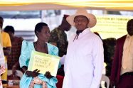 One of the beneficiaries receiving the certificate of customary ownership from the President of Uganda, H.E Yoweri Kaguta Museveni