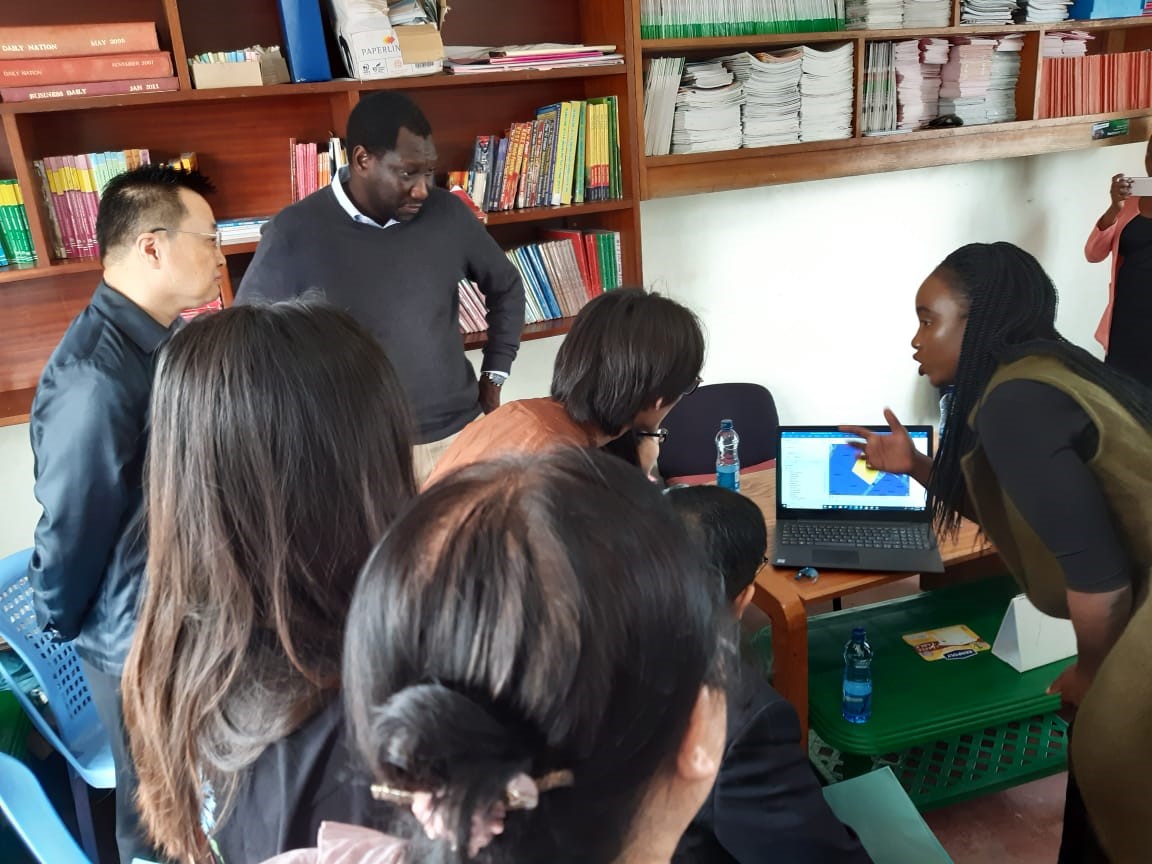 Pamoja Trust and the community in Mashimoni demonstrating the STDM to the Chinese delegation and how it is used to generate social and spatial data in the informal settlements within Kenya