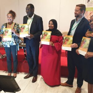 Land and GLTN Unit Leader Oumar Sylla (third from left) displaying copies of the GLTN Gender Strategy (2019-2030) with some of the GLTN partners who participated at the launch.